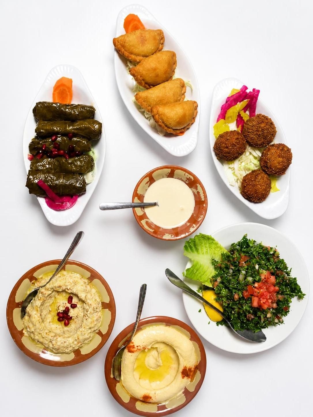 Lebanese mezze spread – grape leaves, sambousek, falafel, hummus and tabbouleh